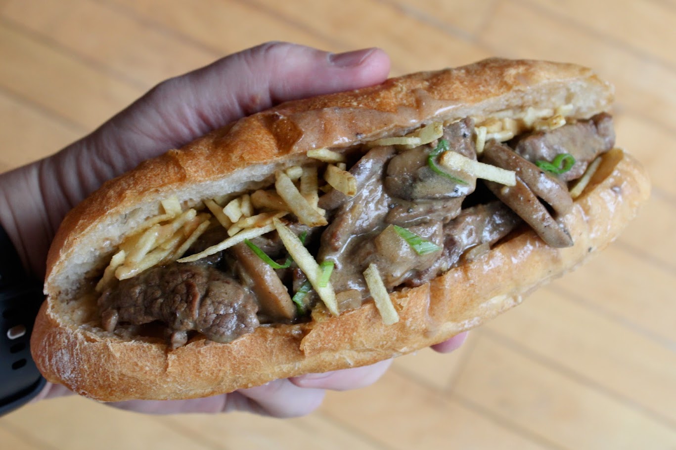 Beef stroganoff sandwich with crispy shoestring potatoes